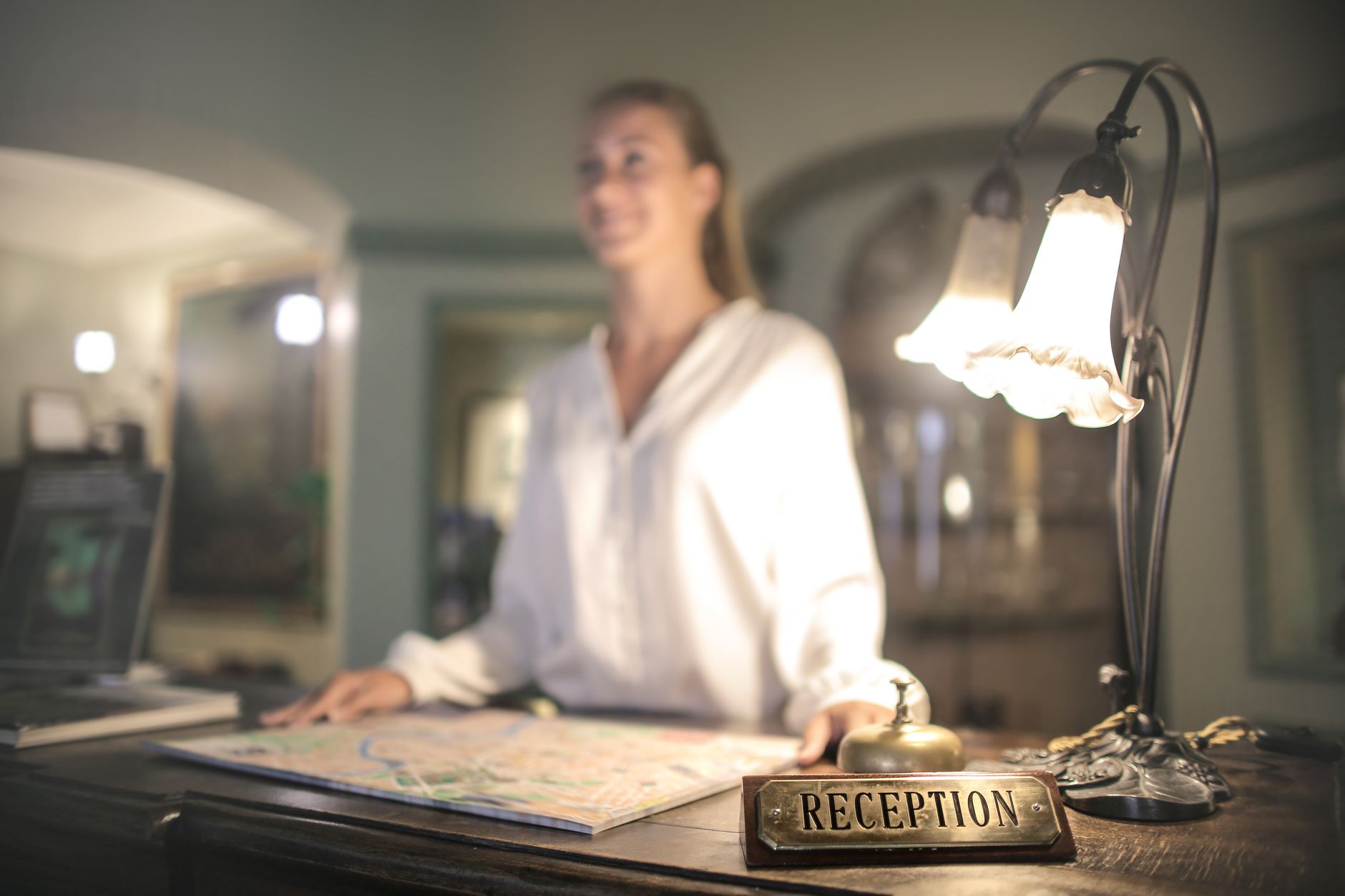 Travel advisor at a reception desk reviewing a map