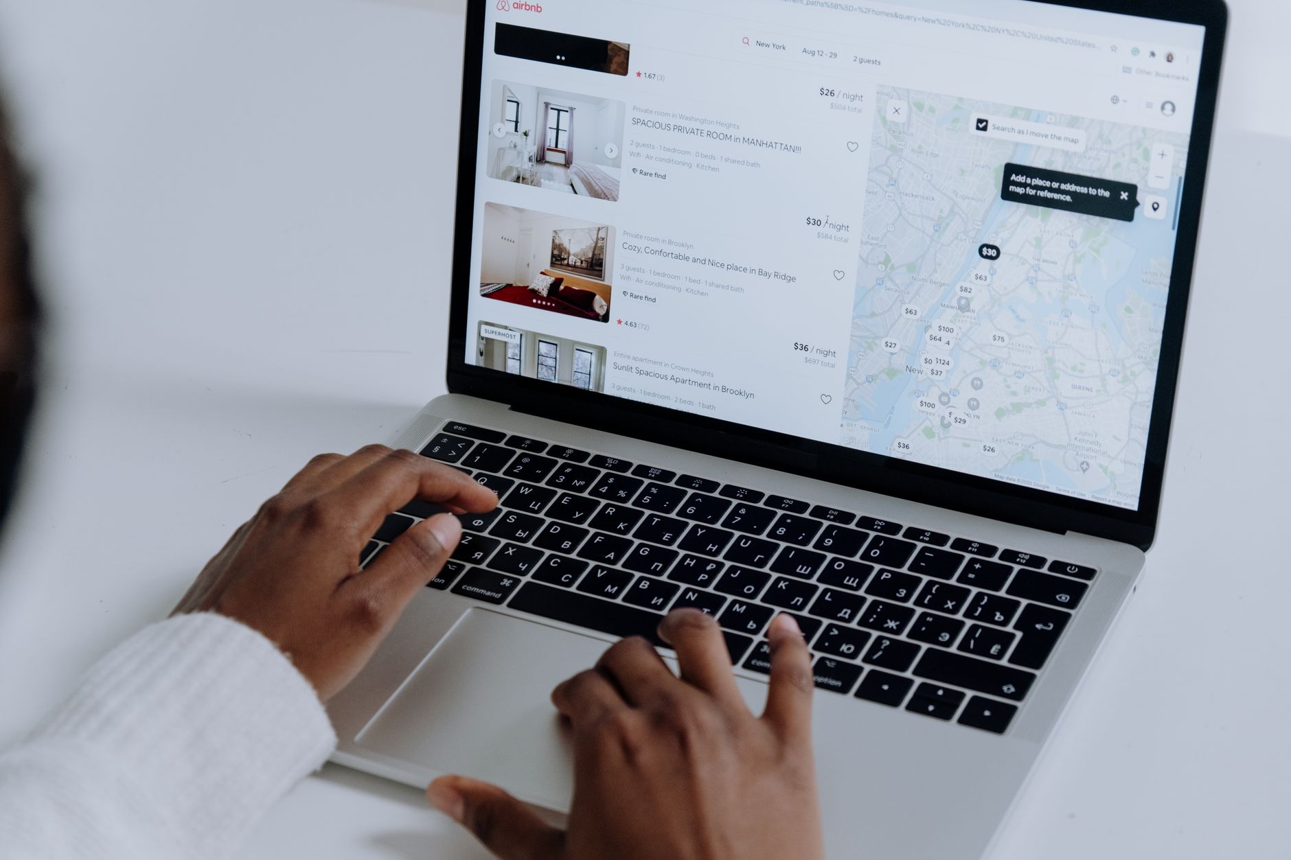 Planning a trip on a laptop with a map view